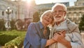 Portrait of beautiful happy senior couple bonding to each other and holding hands while standing in the park together Royalty Free Stock Photo