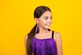 Portrait of beautiful happy smiling teenage girl on yellow studio background. Royalty Free Stock Photo