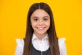 Portrait of beautiful happy smiling teenage girl on yellow studio background. Royalty Free Stock Photo