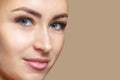 Portrait of a beautiful happy smiling woman with clean skin with blue eyes. Professional makeup and cosmetology skin care
