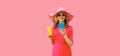 Portrait of beautiful happy smiling young woman with smartphone and cup of juice wearing summer straw hat, pink dress background Royalty Free Stock Photo