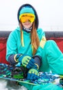 Beautiful happy young snowboarder girl with snowboard. Royalty Free Stock Photo