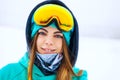 Happy young snowboarder girl in snowboard goggles. Royalty Free Stock Photo