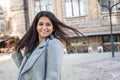 Portrait of a beautiful Indian girl, smiling spinning, dancing with autumn leaves in her hand Royalty Free Stock Photo