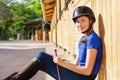 Portrait of beautiful jockey girl at riding stable Royalty Free Stock Photo