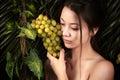 Portrait beautiful korean girl with grapes