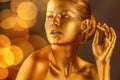 Portrait of beautiful lady with gold paint on skin, closeup