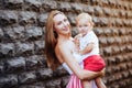 Portrait of beautiful lady and her sweet little baby smiling Royalty Free Stock Photo