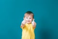 Portrait of beautiful little boy giving you thumbs up Royalty Free Stock Photo