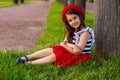 Portrait of a beautiful little brunette girl, in a red beret Royalty Free Stock Photo