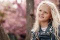 Beautiful little child girl with sakura flowers Royalty Free Stock Photo