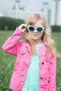 Portrait of a beautiful little five year old girl in a city park Royalty Free Stock Photo