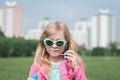 Portrait of a beautiful little five year old girl in a city park Royalty Free Stock Photo