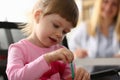 Portrait of beautiful little girl in background is doctor Royalty Free Stock Photo