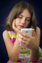 Portrait of beautiful little girl with cell phone Royalty Free Stock Photo