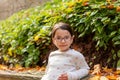 Portrait of a beautiful little girl with glasses in the park Royalty Free Stock Photo