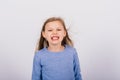 Portrait of beautiful little girl happy smiling on studio. Isolated white background Royalty Free Stock Photo