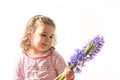 Portrait of a beautiful little girl holding flowers Royalty Free Stock Photo