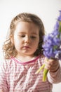 Portrait of a beautiful little girl holding flowers Royalty Free Stock Photo