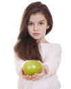Portrait of a beautiful little girl holding a green apple Royalty Free Stock Photo