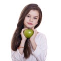 Portrait of a beautiful little girl holding a green apple Royalty Free Stock Photo