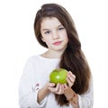 Portrait of a beautiful little girl holding a green apple Royalty Free Stock Photo