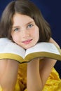 Portrait of beautiful little girl holding Holy Bible Royalty Free Stock Photo