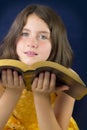 Portrait of beautiful little girl holding Holy Bible Royalty Free Stock Photo