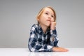 Portrait of beautiful little girl looking away, dreaming isolated on gray studio background. Human emotions, facial Royalty Free Stock Photo