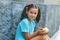 Portrait of a beautiful little girl with peaches