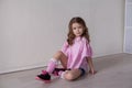 Portrait of a beautiful little girl in a pink dress five years Royalty Free Stock Photo