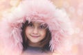 Portrait of a beautiful little girl with pink fur hood Royalty Free Stock Photo