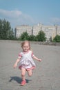 Portrait of beautiful little girl running towards camera with smile Royalty Free Stock Photo