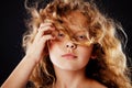 Portrait of beautiful little girl with windy hair. Fashion photo Royalty Free Stock Photo