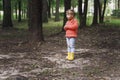 Portrait of a beautiful little girl 4 years old in a red sweater in autumn Royalty Free Stock Photo