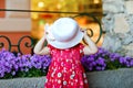 Portrait of beautiful little gorgeus lovely toddler girl in pink summer look clothes, fashion dress, knee socks and hat Royalty Free Stock Photo