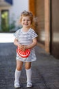 Portrait of beautiful little toddler girl in summer look clothes, fashion dress, knee socks . Happy healthy baby child Royalty Free Stock Photo