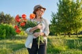 Portrait of beautiful mature healthy happy woman with bouquet of poppies Royalty Free Stock Photo