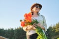 Portrait of beautiful mature healthy happy woman with bouquet of poppies Royalty Free Stock Photo
