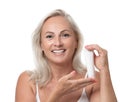 Portrait of beautiful mature woman with perfect skin holding tube of cream