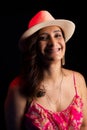 Portrait of beautiful mature woman, wearing hat, looking good and happy. Hopeful and confident person