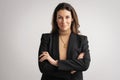 Portrait of beautiful mid aged woman with brunette hair wearing blazer and cheerful smiling against at isolated background Royalty Free Stock Photo