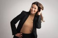 Portrait of beautiful mid aged woman with brunette hair wearing blazer and cheerful smiling against at isolated background Royalty Free Stock Photo