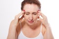 Portrait of beautiful middle aged brunette woman with headache on white. Migraine, menopause and stress. Copy space and m