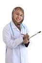 Portrait of beautiful middle aged smiling Asian Muslim woman doctor with holding doctor stethoscope wearing traditional hijab Royalty Free Stock Photo