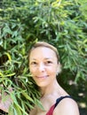 Portrait of a beautiful middle-aged woman in a greenhouse. Royalty Free Stock Photo