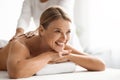 Portrait Of Beautiful Middle Aged Woman Having Back Massage In Spa Salon Royalty Free Stock Photo