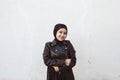 Portrait of beautiful middle-eastern girl in traditional Islamic clothing - hijab. Modern and young Iranian woman in leather Royalty Free Stock Photo