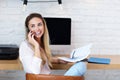 Portrait of beautiful millennial woman working in modern home office