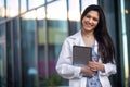 Portrait of a beautiful mixed ethnicity Hispanic Indian woman, medical professional, student, intern, or assistant at the workplac Royalty Free Stock Photo